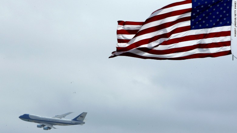 Air Force One flies past an American flag on its way into Daytona Beach, Florida, in 2004. The U.S. Air Force announced Wednesday, January 28, that a customized military version of Boeing&#39;s 747-8 will serve as Air Force One for future Presidents. Click through to see the different airplanes that have served as the President&#39;s transportation over the years.