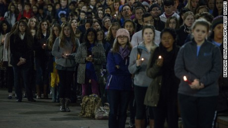 People listen during a vigil at UNC Chapel Hill in February 2015.