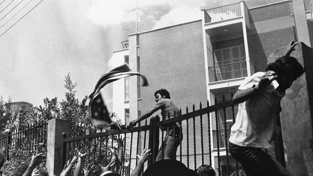 Angry demonstrators rip the American flag from the United States Embassy in Nicosia, Cyprus, on August 19, 1974, during a demonstration against American policy on Cyprus. Rodger Davies, the U.S. ambassador to Cyprus, was killed by gunfire during the incident.