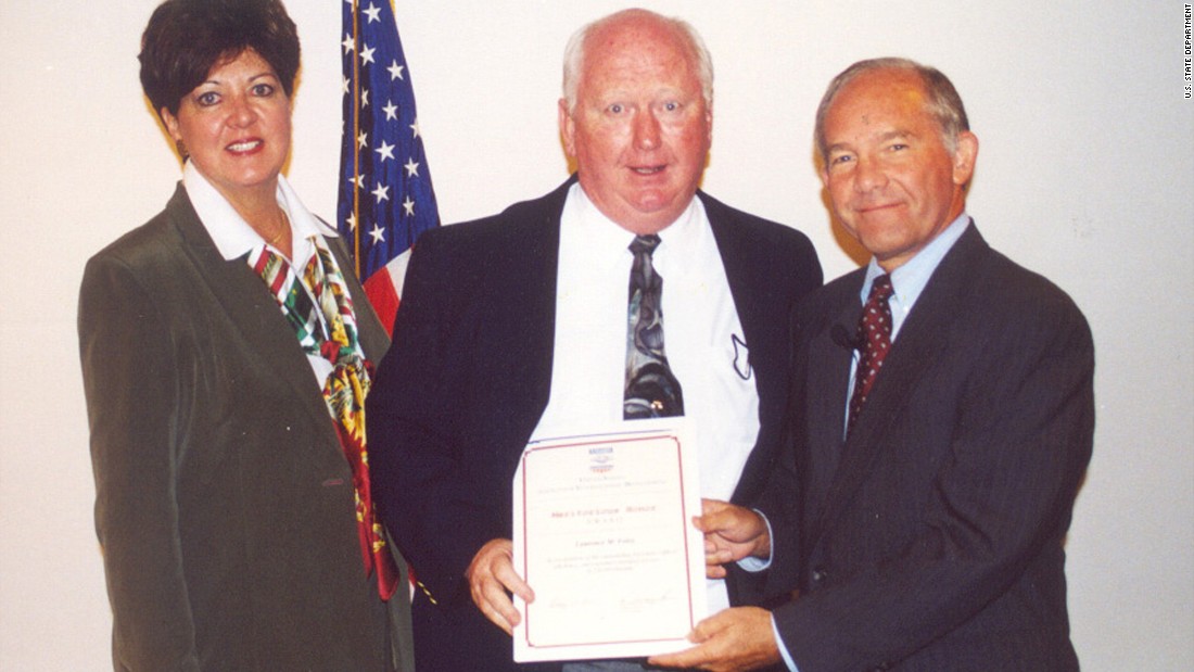 Laurence Foley, an employee of the U.S. Agency for International Development, receives an achievement award from U.S. Ambassador to Jordan Edward Gnehm, right, and USAID Mission Director Toni Christiansen-Wagner in October 2002. Two months later, Foley was shot dead by a lone gunman outside his home in Amman, Jordan.