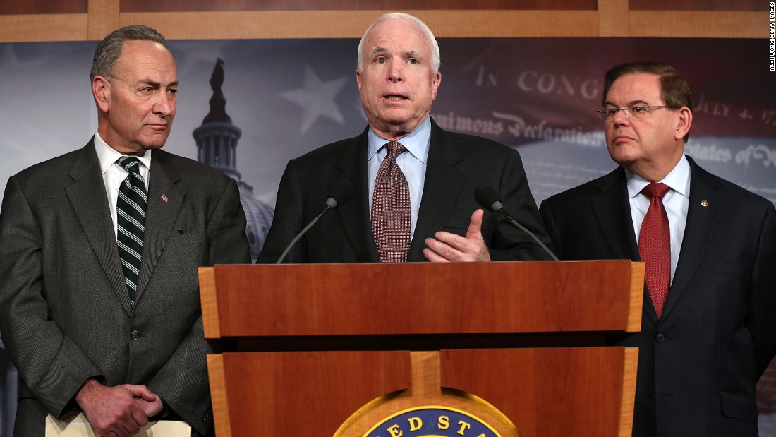 Sen. John McCain (R-AZ) (center) speaks as Sen. Charles Schumer (D-NY) (left) and Sen. Robert Menendez (D-NJ) (right) listen during a news conference on a comprehensive immigration reform framework January 28, 2013 on Capitol Hill in Washington.
