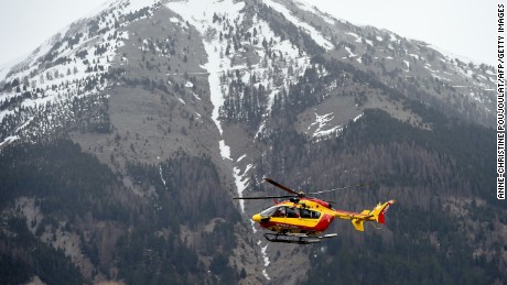 A helicopter carries security personnel on March 24 in Seyne, France, near the crash site.