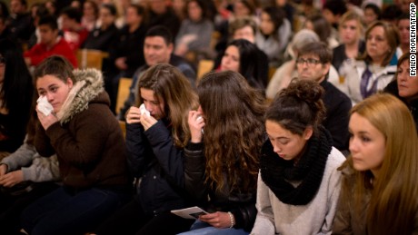 Friends of the German students from the crashed plane attend a mass in Llinars del Valles, near Barcelona, Spain, Tuesday, March 24, 2015. Sixteen 10th-grade students from a town in western Germany and two of their teachers had just spent a week on an exchange near Barcelona and were less than an hour from landing when their Germanwings flight crashed in southern France. Officials confirmed Tuesday they were among the 150 people who died in the crash. (AP Photo/Emilio Morenatti)