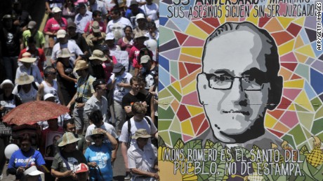 Catholic faithfuls march holding a banner depicting the late Monsignor Oscar Arnulfo Romero, in San Salvador on March 24, 2015, during the 35th anniversary of his murder. Romero will be beatified in El Salvador next May 23, 2015. AFP PHOTO / MARVIN RECINOSMarvin RECINOS/AFP/Getty Images