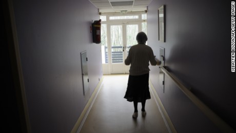 A woman, suffering from Alzheimer&#39;s desease, walks in a corridor on March 18, 2011 in a retirement house in Angervilliers, eastern France. AFP PHOTO / SEBASTIEN BOZON (Photo credit should read SEBASTIEN BOZON/AFP/Getty Images)