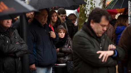 People pay a moment of silence in Llinars del Valles, Spain, on Wednesday, March 25.