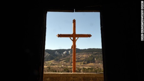 A Christian cross is pictured at Seyne-les-Alpes in the French Alps on Friday, March 27, a day after families of victims arrived on the site near the plane crash. Germanwings Flight 9525 was carrying at least 150 people when it crashed in the French Alps on Tuesday.  