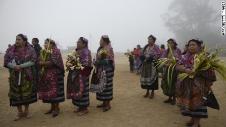 An indigenous woman prepares to take part in the Palm Sunday procession on March 29, 2015 in San Pedro Sacatepequez, 30 km west of Guatemala City. AFP PHOTO/Johan ORDONEZJOHAN ORDONEZ/AFP/Getty Images