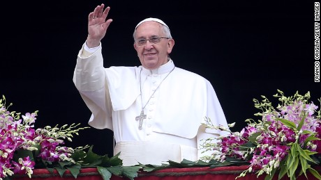 Pope Francis waves to the faithful as he delivers his &#39;Urbi et Orbi&#39; blessing message from the central balcony of St Peter&#39;s Basilica at the end of the Easter Mass on April 5 in Vatican City, Vatican.