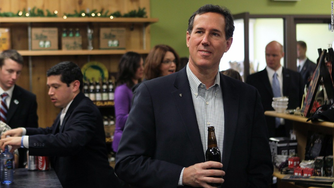 Santorum tries one of the local craft beers while having lunch at Simon&#39;s Specialty Cheese following a campaign stop in Appleton, Wisconsin, on April 2, 2012.