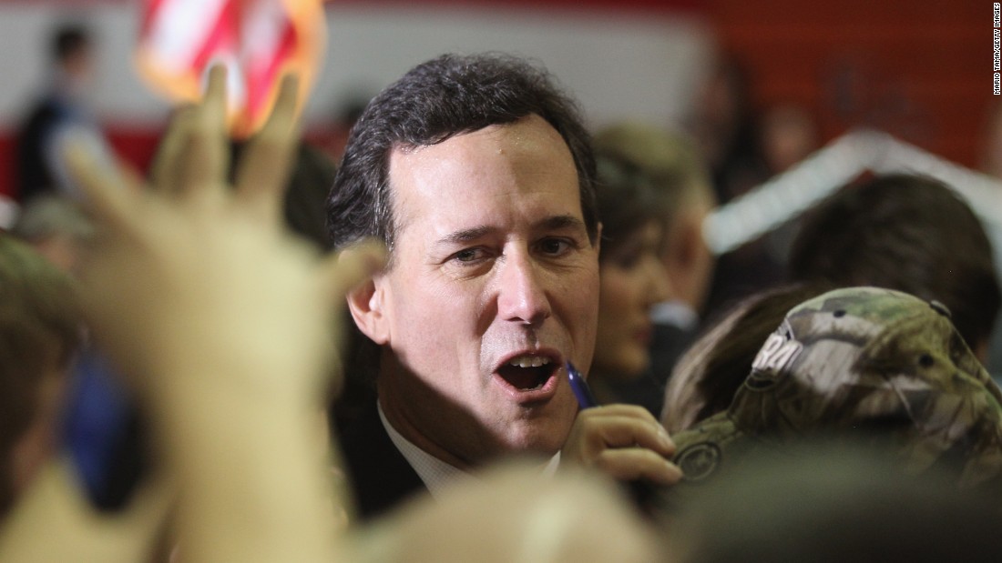 Santorum greets supporters during an election night rally at the Steubenville High School gymnasium in Steubenville, Ohio, on March 6, 2012.