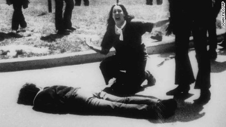 *** FILE *** Mary Ann Vecchio gestures and screams as she kneels by the body of a student lying face down on the campus of Kent State University, Kent, Ohio on May 4, 1970. A static-filled recording was released Tuesday May 1, 2007 of the 1970 Kent State University shooting that killed four students raising questions not only about whether someone called on National Guardsmen to fire, but also who might have given the order. The tape was released by Alan Canfora, 58, one of nine students wounded in the 1970 shootings. He played two versions of the tape _ the original and an amplified version _ in which he says a Guard officer issues the command, &quot;Right here! Get Set! Point! Fire!&quot;  (AP Photo/John Filo)