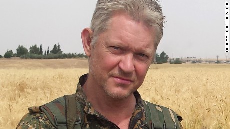 Michael Enright, a British actor who has had minor roles in Hollywood films, poses for a photo after he joined Kurdish fighters battling against ISIS.