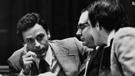 Accused murderer Theodore Bundy, left, makes a point to members of his defense team after the opening of his trial in Miami, June 26, 1979.  Hypnotism specialist Dr. Emil Spillman, an Atlanta physician, center, joined Bundy&#39;s defense team as a consultant in selecting the jury.  Bundy is accused in the murders of two sorority sisters in Tallahassee early in 1978.