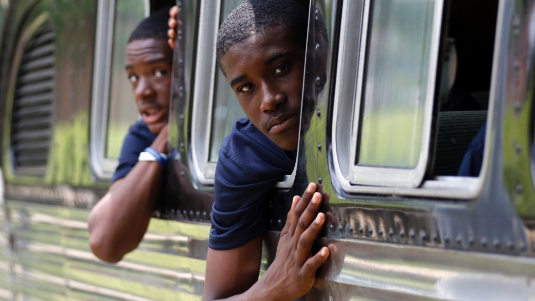 Tamir Brooks, right, and Sami Wylie look out of the windows of the 1947 vintage bus they are traveling on as they leave the Civil Rights Institute in Birmingham, Alabama, on June 24.