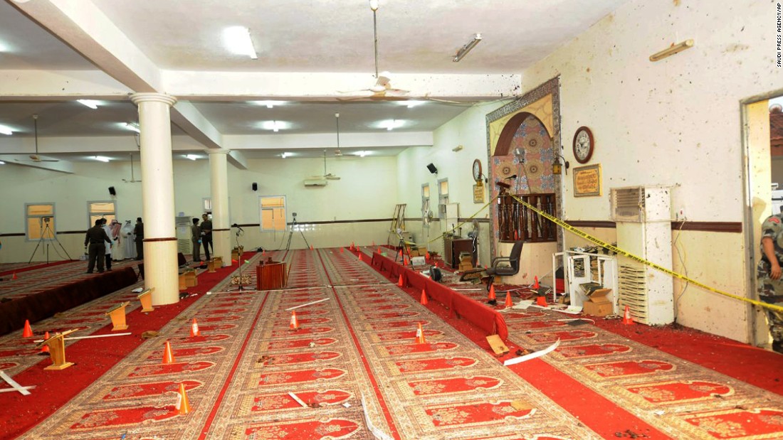 Saudi officials and investigators check the inside of the mosque on August 6.