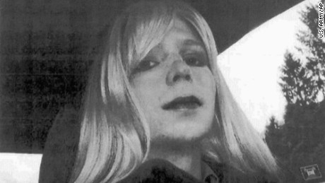 FILE - In this undated file photo provided by the U.S. Army, Pfc. Chelsea Manning poses for a photo wearing a wig and lipstick. A military prison psychologist is refusing to recommend that Manning&#39;s gender be officially changed to female on her Army employee-benefits file. Lawyers for the transgender solider imprisoned for leaking classified information made the assertion in a federal court filing Monday, Dec. 5, 2016, in Washington. (U.S. Army via AP, File)