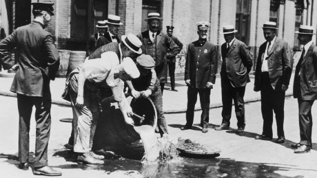 Alcohol is poured away into a New York sewer during the prohibition era, circa 1920. (Photo by FPG/Hulton Archive/Getty Images)
