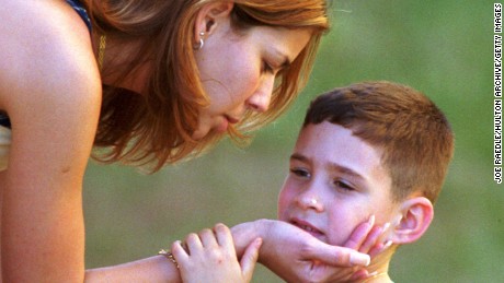 367992 15: FILE PHOTO: Marisleysis Gonzalez consoles her cousin, Elian Gonzalez, April 19, 2000 in the Little Havana district of Miami. The U.S. Supreme Court cleared the way June 28, 2000 for shipwreck survivor Elian Gonzalez to return to Cuba, a crushing defeat for his Miami relatives in the international custody fight over the child. (Photo by Joe Raedle/Newsmakers)