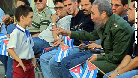Cuban president Fidel Castro (2nd R) talks with Elian Gonzalez (L), 14 July 2001 in Cardenas, Cuba during a political gathering to inaugurate &quot;Museo a la Batalla de Ideas&quot; where a diverse range of objects relating to Elian&#39;s custody battle in with the US is being exhibited.  To the right is Elian&#39;s father, Juan Miguel Gonzalez. Elian Gonzalez was aboard an overcrowded motorboat that capsized en route from Cuba to Florida, killing his mother and her boyfriend along with others seeking to enter the United States illegally. He was rescued off Florida 25 November 1999, and then was at the center of a seven-month custody tug-of-war that culminated in US federal agents seizing him by force from Miami-based relatives. He was returned to Cuba one year ago. AFP PHOTO/ADALBERTO ROQUE   (Photo credit should read ADALBERTO ROQUE/AFP/Getty Images)