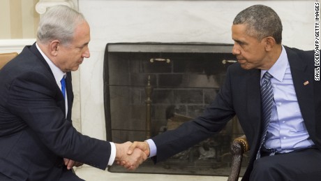 US President Barack Obama(R) and Israeli Prime Minister Benjamin Netanyahu shake hands during a meeting in the Oval Office of the White House in Washington, DC, November 9, 2015. 