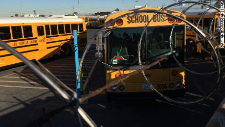 Los Angeles School District buses are parked at their bus garage in Gardena, Calif., Tuesday, Dec. 15, 2015. The nation&#39;s second-largest school district shut down Tuesday after a school board member received an emailed threat that raised fears of another attack like the deadly shooting in nearby San Bernardino. (AP Photo/Damian Dovarganes)