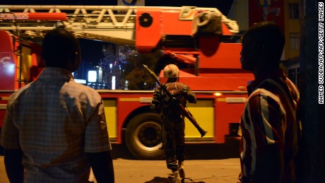 Burkina Faso&#39;s soldier stands near Hotel Splendid where the attackers remain with sporadic gunfire continuing in Burkina Faso&#39;s capital Ouagadougou on January 15, 2016. Attackers have killed &quot;several people&quot; at a restaurant opposite a four-star hotel where the assailants are holed up, a restaurant staff member told AFP. / AFP / AHMED OUOBA        (Photo credit should read AHMED OUOBA/AFP/Getty Images)