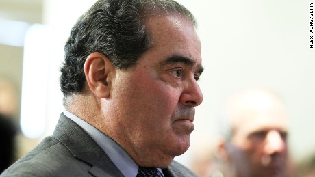 Supreme Court Justice Antonin Scalia waits to be introduced to speak on October 2, 2012, in Washington, D.C.