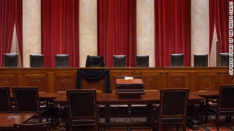The Courtroom of the Supreme Court showing Associate Justice Antonin Scalia&#39;s Bench Chair and the Bench in front of his seat draped in black following his death on February 13, 2016.  