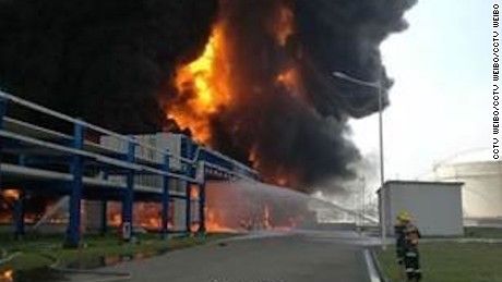 Location of the fire is at the Jiangsu Deqiao Storage Company Ltd in the New Port Industrial Park in Jingjiang city.  The fire reached 20 - 30 meters in the air with thick mushroom-like smoke.  According to rescue workers at the scene, the burning articles were two gas containers.  The company&#39;s main business is in storing, transferring, repartitioning and packaging liquid oil/gas products.  The factory zone has 12 fuel containers, diesel containers and gasoline containers, and 30 chemical storage containers.  
The report also quotes a villager Mr. Zhong, whose home is within 1km away from the storage zone that there are two villages near the company with over 1k villagers (altogether).
