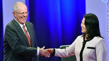 Peruvian presidential candidates Pedro Pablo Kuczynski of "Peruanos por el Kambio" and Keiko Fujimori of Fuerza Popular shake hands after a televised nation-wide debate in the northern city of Piura, 970 kilometers north of Lima, on May 22, 2016. 
The two candidates, who both offer a centrist political platform and are direct descendants of immigrants in a country with a large indigenous population, will compete in the June 5 runoff election. / AFP / CRIS BOURONCLE        (Photo credit should read CRIS BOURONCLE/AFP/Getty Images)