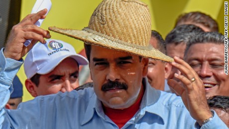Venezuelan President Nicolas Maduro wears a hat during a rally in Caracas on May 31, 2016.
Venezuelan President Nicolas Maduro called for a "national rebellion" against alleged international threats Tuesday and told the head of the Organization of American States to "shove it" in an escalating war of words. / AFP / JUAN BARRETO        (Photo credit should read JUAN BARRETO/AFP/Getty Images)