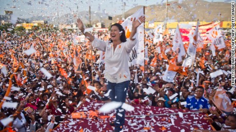 TOPSHOT - Peruvian presidential candidate for the Fuerza Popular (Popular Force) party and daughter of imprisoned former Peruvian President (1990-2000) Alberto Fujimori, Keiko Fujimori, waves during a rally in Lima on May 31, 2016.
Fujimori leads the polls for next May 5 presidential elections in Peru.  / AFP / ERNESTO BENAVIDES        (Photo credit should read ERNESTO BENAVIDES/AFP/Getty Images)