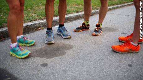 With their brightly colored running shoes, Icebreakers and guest runners go over a tricky part of the route before hitting the road in Atlanta.