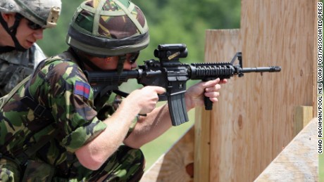 FILE - In this June 25, 2010, file photo Britain&#39;s Prince Harry fires a Colt M4 assault riffle on a United States Military Academy range in West Point, N.Y.  The Defense Department is searching for the successor to the M4 combat rifle and gun makers are loading with lobbyists to win the work. Colt Defense of West Hartford, Conn., had an exclusive deal to provide M4s to the U.S. military and didnt need a hired gun looking out for its interests in Washington. (AP Photo/Chad Rachman, Pool, File)