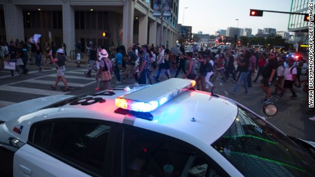 People rally in Dallas, Texas, on Thursday, July 7, 2016 to protest the deaths of Alton Sterling and Philando Castile.
Black motorist Philando Castile, 32, a school cafeteria worker, was shot at close range by a Minnesota cop and seen bleeding to death in a graphic video shot by his girlfriend that went viral Thursday, the second fatal police shooting to rock America in as many days. / AFP / Laura Buckman        (Photo credit should read LAURA BUCKMAN/AFP/Getty Images)