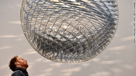 A man looks at an artwork by Danish-Icelandic artist Olafur Eliasson entitled &quot;Schools of Movement Sphere&quot; displayed at the Frieze Art Fair in London on October 14, 2014. AFP PHOTO/BEN STANSALL  == RESTRICTED TO EDITORIAL USE, MANDATORY MENTION OF THE ARTIST, TO ILLUSTRATE THE EVENT AS SPECIFIED IN THE CAPTION  ==        (Photo credit should read BEN STANSALL/AFP/Getty Images)