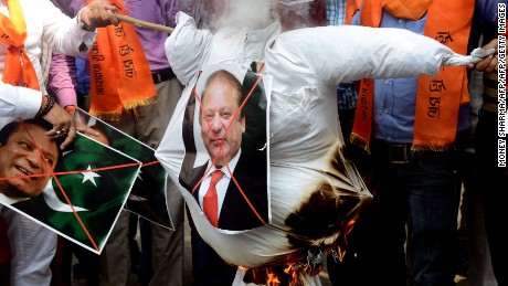 Indian right-wing activists burn an effigy of Pakistan&#39;s Prime Minister Nawaz Sharif during a protest against Pakistan, in New Delhi on September 19, 2016. India on September 19 weighed its response to a bloody raid on an army base in Kashmir which  fuelled tensions with nuclear-armed Pakistan, as some politicians called for military action after the worst attack of its kind in over a decade. New Delhi has said that Pakistan-based militants were behind the September 18 attack in which 17 soldiers were killed, raising the prospect of a military escalation in the already tense disputed Himalayan region.
 / AFP / MONEY SHARMA        (Photo credit should read MONEY SHARMA/AFP/Getty Images)