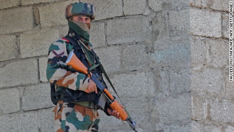 An Indian army soldier takes up a position near the site of a gunbattle between Indian army soldiers and rebels inside an army brigade headquarters near the border with Pakistan, known as the Line of Control (LoC), in Uri on September 18, 2016.
Militants armed with guns and grenades killed 17 soldiers in a raid September 18 on an army base in Indian-administered Kashmir, the worst such attack for more than a decade in the disputed Himalayan region. / AFP / TAUSEEF MUSTAFA        (Photo credit should read TAUSEEF MUSTAFA/AFP/Getty Images)