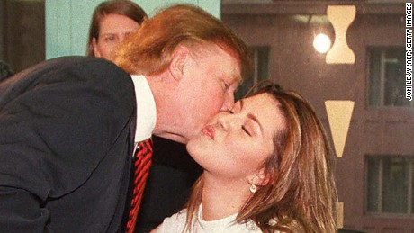 NEW YORK, NY - JANUARY 28:  Miss Universe, Venezuela&#39;s Alicia Machado, kisses Donald Trump, owner of the Miss Universe pageant, 28 January during her daily fitness workout at a health center in New York. The 19 year-old Machado started a new fitness program after she was criticized for gaining weight after winning the 1996 Miss Universe pageant. She claims to have lost five pounds in three days. AFP PHOTO Jon LEVY  (Photo credit should read JON LEVY/AFP/Getty Images)