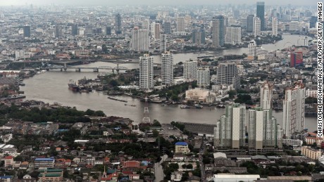 This aerial picture taken on April 5, 2014 shows a general view of the skyline and the Chao Phraya river passing through Bangkok. The World Bank on April 7 said developing countries in East Asia will grow 7.1 percent in 2014 as they benefit from a stabilising global economy and withstand the impact of US stimulus cuts. However, the report said larger Southeast Asian economies, including Indonesia and Thailand, will face tougher global financial conditions and higher levels of household debt.  AFP PHOTO / Christophe ARCHAMBAULT        (Photo credit should read CHRISTOPHE ARCHAMBAULT/AFP/Getty Images)