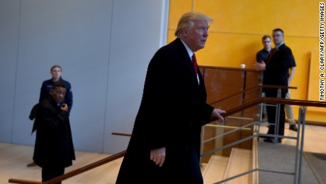 US President-elect  Donald Trump leaves after a meeting at the New York Times on November 22, 2016 in New York.
US President-elect Trump said Tuesday he has an open-mind about pulling out of world climate accords and admitted global warming may be in some way linked to human activity.&quot;I think there is some connectivity. Some, something. It depends on how much,&quot; he told a panel of New York Times journalists. 
 / AFP / TIMOTHY A. CLARY        (Photo credit should read TIMOTHY A. CLARY/AFP/Getty Images)