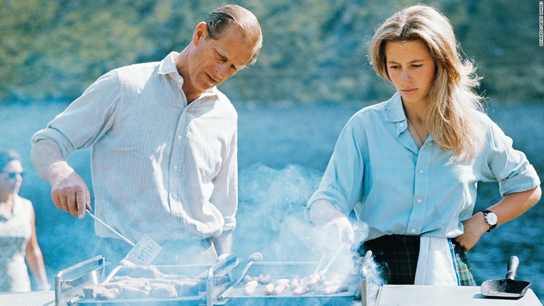 Prince Philip and his daughter, Princess Anne, prepare a barbecue on the Balmoral Castle estate in August 1972.