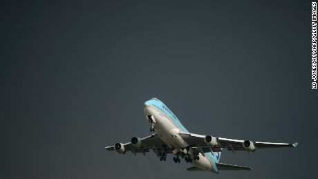 In a photo taken on August 26, 2014 a Korean Air Boeing 747 aircraft takes off before storm clouds at Gimpo airport, south of Seoul. South Korea's international air passenger traffic grew more than 10 percent in July from a year earlier with the number of international air passengers to and from South Korea at 5.13 million, up 10.6 percent from the previous year, according to the Ministry of Land, Infrastructure and Transport. AFP PHOTO / Ed Jones        (Photo credit should read ED JONES/AFP/Getty Images)