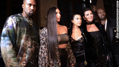 (From L) Kanye West, Kim Kardashian, Kourtney Kardashian, Kris Jenner and Corey Gamble attend the Off-white 2017 Spring/Summer ready-to-wear collection fashion show, on September 29, 2016 in Paris. / AFP / ALAIN JOCARD        (Photo credit should read ALAIN JOCARD/AFP/Getty Images)