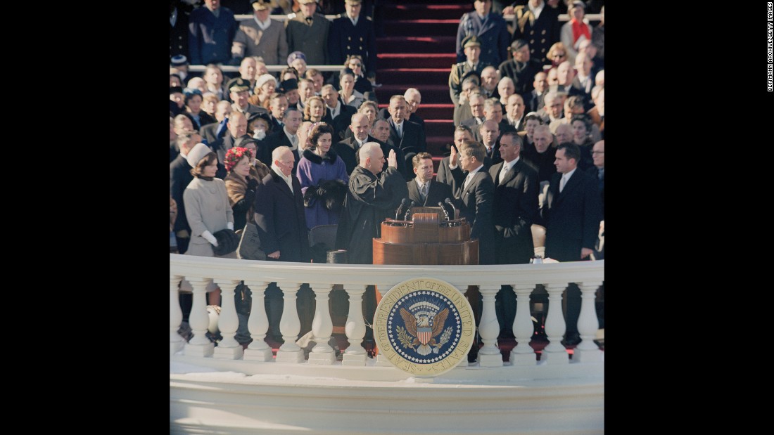 John F. Kennedy is sworn in by Chief Justice Earl Warren in 1961. Kennedy, at 43, was the youngest ever to be elected president. This was the first inauguration ceremony to be televised in color.