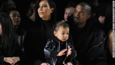 NEW YORK, NY - FEBRUARY 14:  (L-R) Kim Kardashian, North West and Kanye West attend the Alexander Wang Fashion Show during Mercedes-Benz Fashion Week Fall 2015 at Pier 94 on February 14, 2015 in New York City.  (Photo by Craig Barritt/Getty Images)