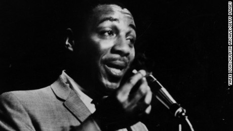 Black comedian Dick Gregory at the microphone, 1962.  (Photo by Three Lions/Getty Images)