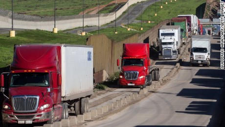 Trucks line up to cross to the United States near the Otay Commercial port of entry on the Mexican side of the US-Mexico border, on January 25, 2017, on the outskirts Tijuana, northwestern Mexico.
President Donald Trump ordered work to begin on building a wall across the Mexican border, angering his southern neighbor with his hardline stance on immigration. / AFP / GUILLERMO ARIAS        (Photo credit should read GUILLERMO ARIAS/AFP/Getty Images)