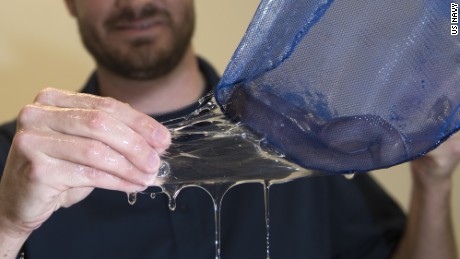 Dr. Ryan Kincer demonstrates the elasticity of the hagfish slime secreted from the the Pacific hagfish within the net aboard Naval Surface Warfare Center Panama City Division (NSWC PCD) Nov. 29, 2016. U.S. Navy photo by Ron Newsome (Released) 161129-N-PB086-014 